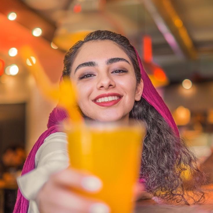 Alex Rivera, Lead Design Curator at GrovePaperPavilion, reviewing corporate floral arrangements